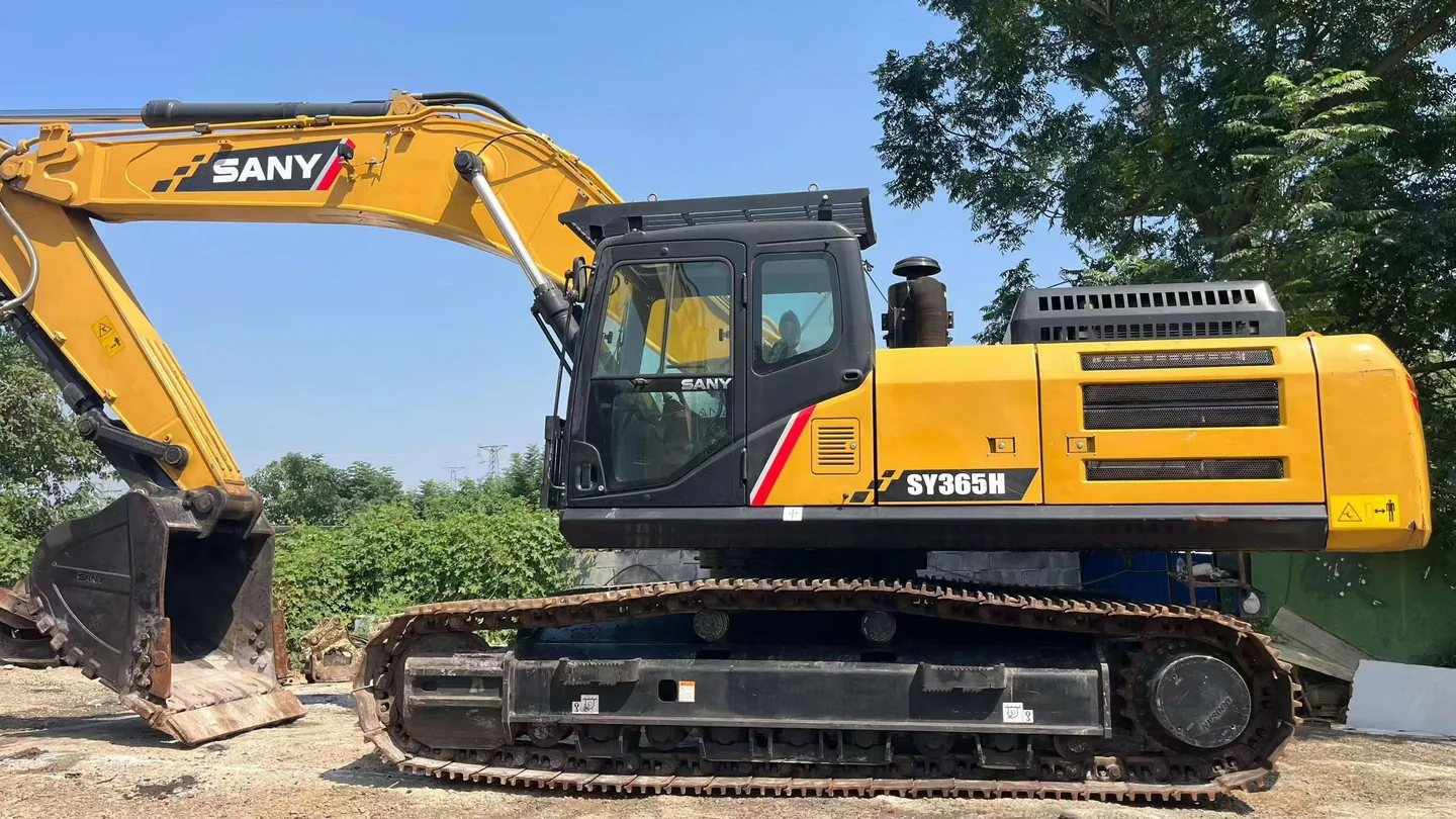 Yellow tracked excavator photographed from the side